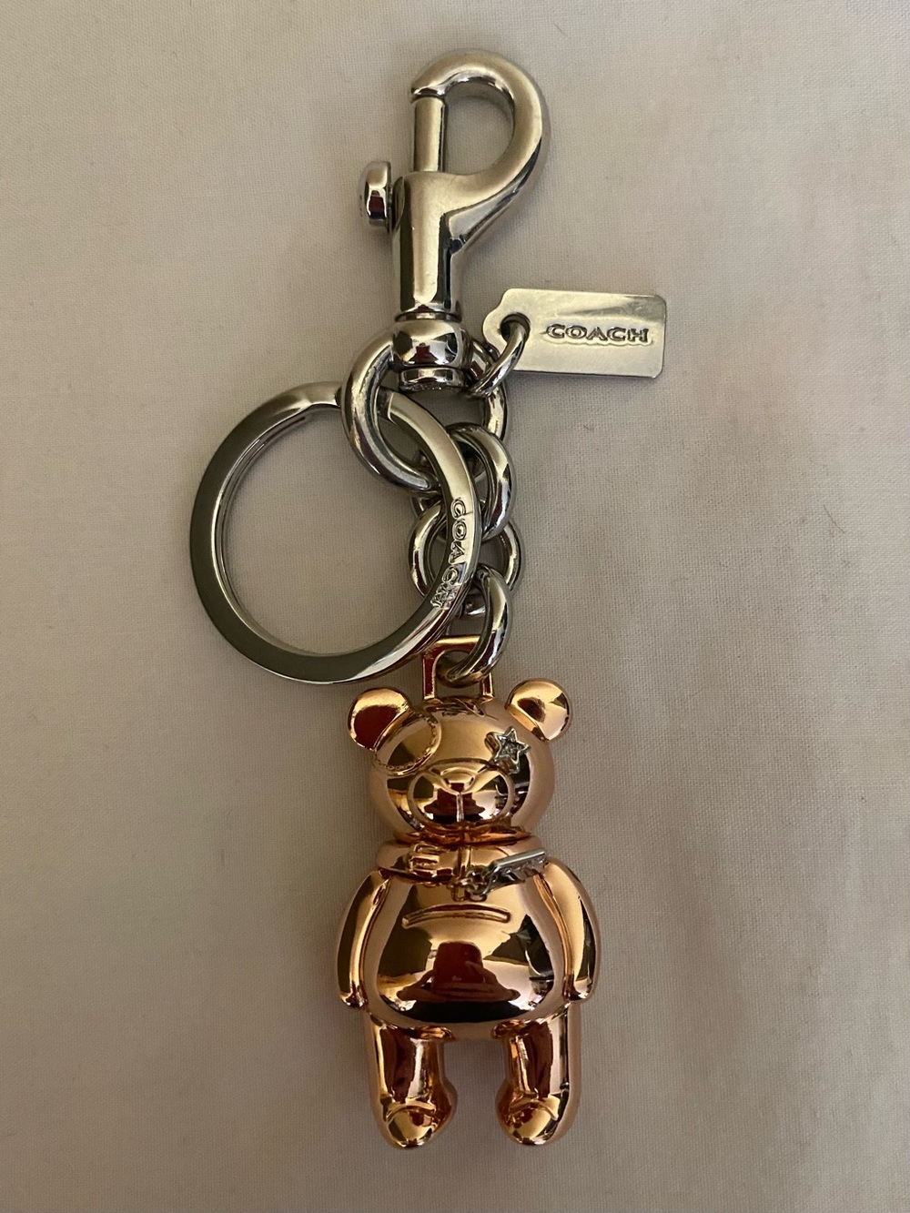 COACH Rose Gold Teddy Bear Keychain with Silver Hardware